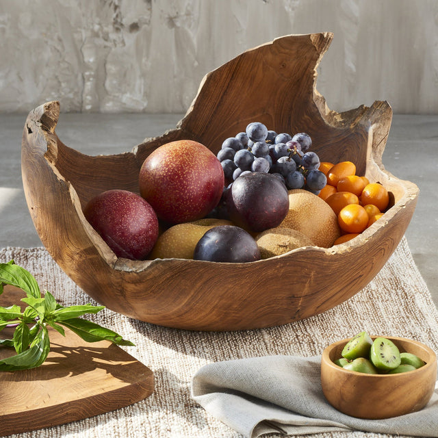 Lot - Two fruitwood bowls with decorative spheres and faux fruit